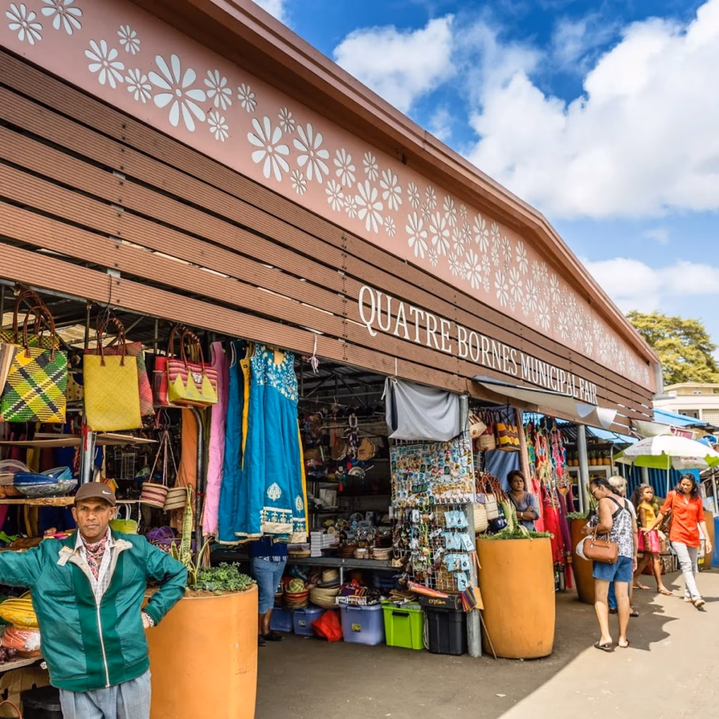 Super Holidays | Best Markets in Mauritius: 4 Must-Visit Local Markets | Super Holidays Mauritius Busy Quatre Bornes Market with colorful textiles and shoppers