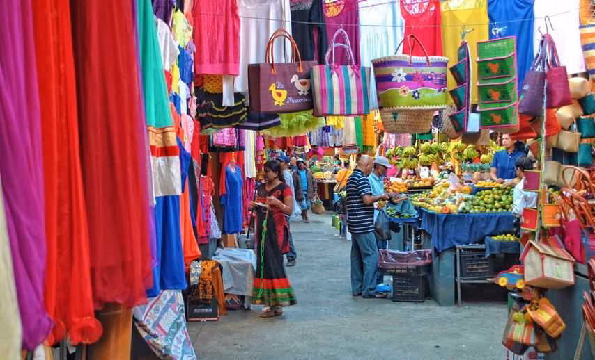 Super Holidays | Best Markets in Mauritius: 4 Must-Visit Local Markets | Super Holidays Mauritius Busy Mahebourg Market with colorful textiles and shoppers